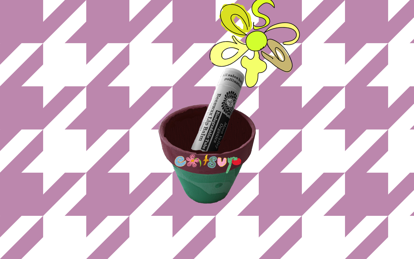 a patterned purple houndstooth background holds a small, terracotta pot painted green holding a disposable lip balm that looks the same as a regular one but it says 
