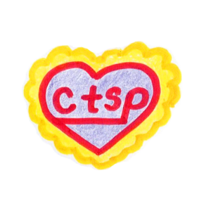 a purple heart with a golden yellow ruffle border holds the letters 'ctsp' inside