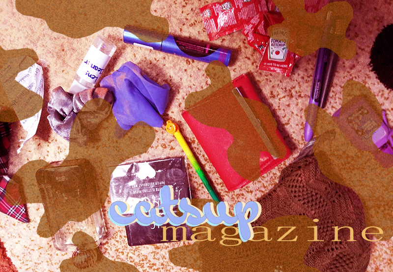a photograph of a purse's contents with a red wallet in the center, accessories tossed around, and a pile of ketchup packets in the top right corner. a 'catsup magazine' namemark is on the lower right and brown cow print is over the image