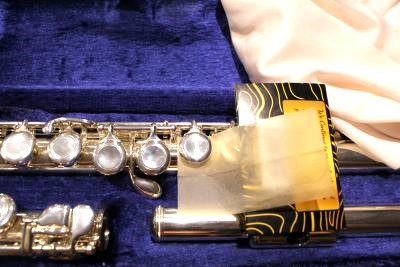 Cleaning a flute's keys is a part of the instrument's maintenance as well as keeping a tidy case.